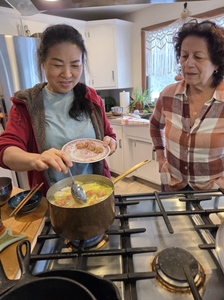 Luo Teaches Mary how to make Chinese dumplings